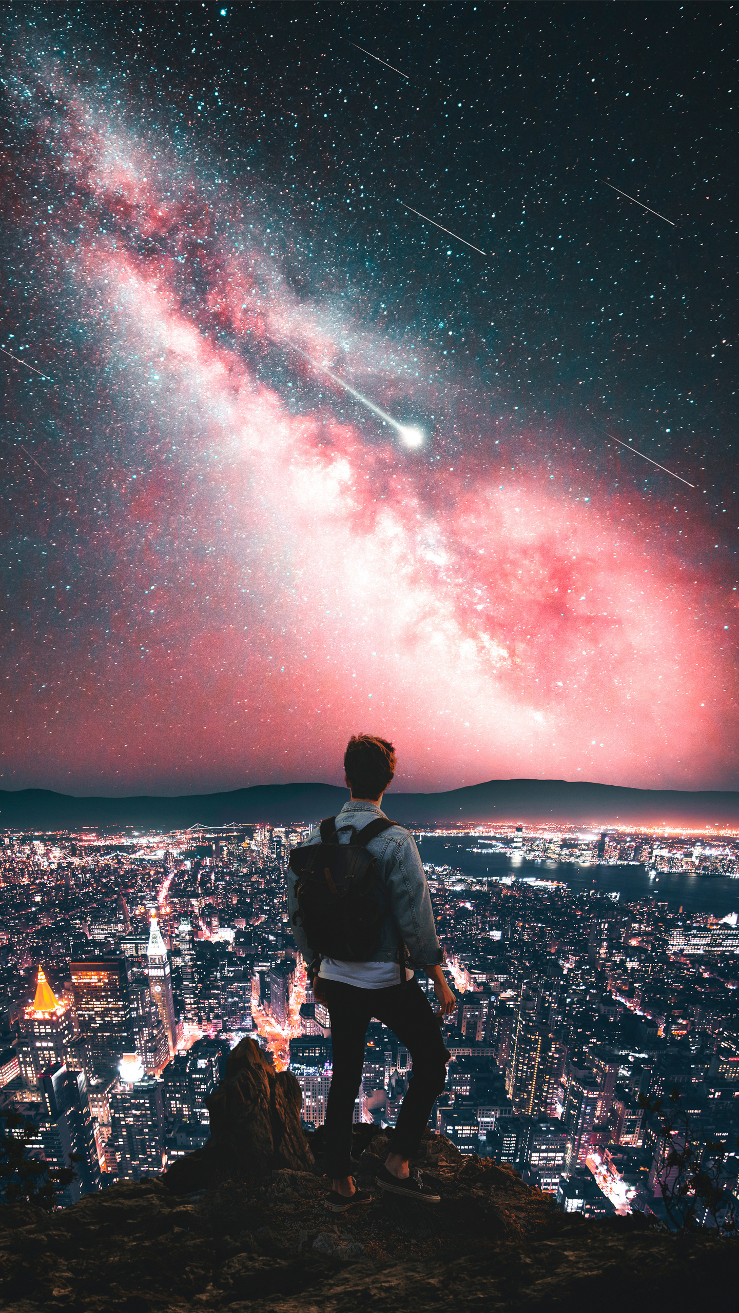  a man standing in front of galaxy star red sky